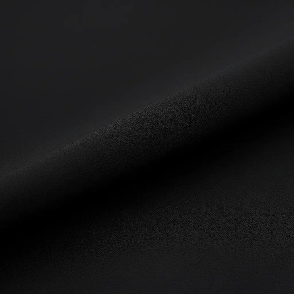 Petra – Elegantní černé one-shoulder šaty s volány Karolina Prague